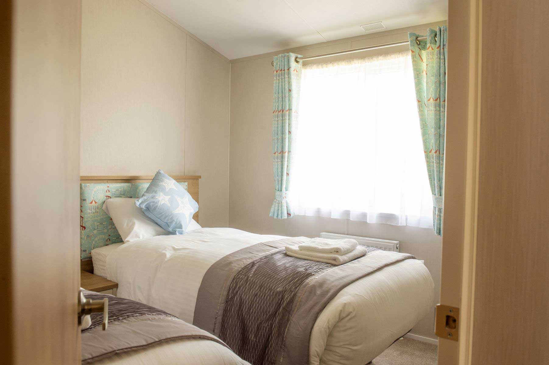 Beach House Lodge Twin Bedroom at Crealy